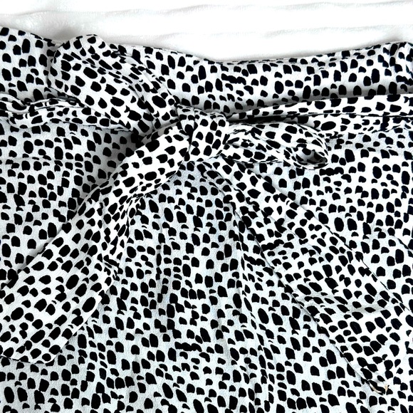 Express | Black & White Dotted Ruffled Wrap Mini Skirt with Tie - Picture 3 of 8